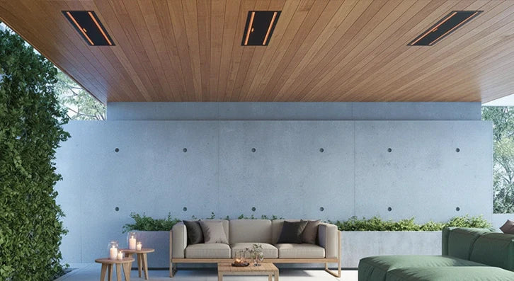 Ceiling-recessed infrared outdoor heaters installed in a timber patio roof above an outdoor lounge area