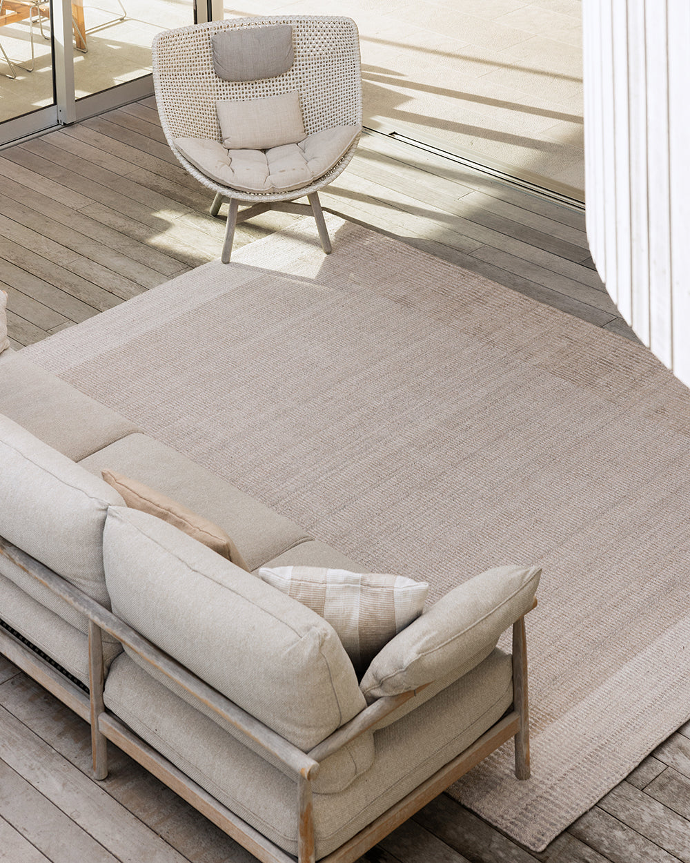 Bedrock Outdoor Rug — Sand styled setting detail, 160 x 230 cm to 300 x 400 cm
