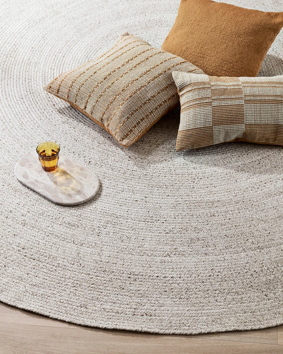 Corfu Outdoor Round Floor Rug in Ivory styled in an outdoor living space