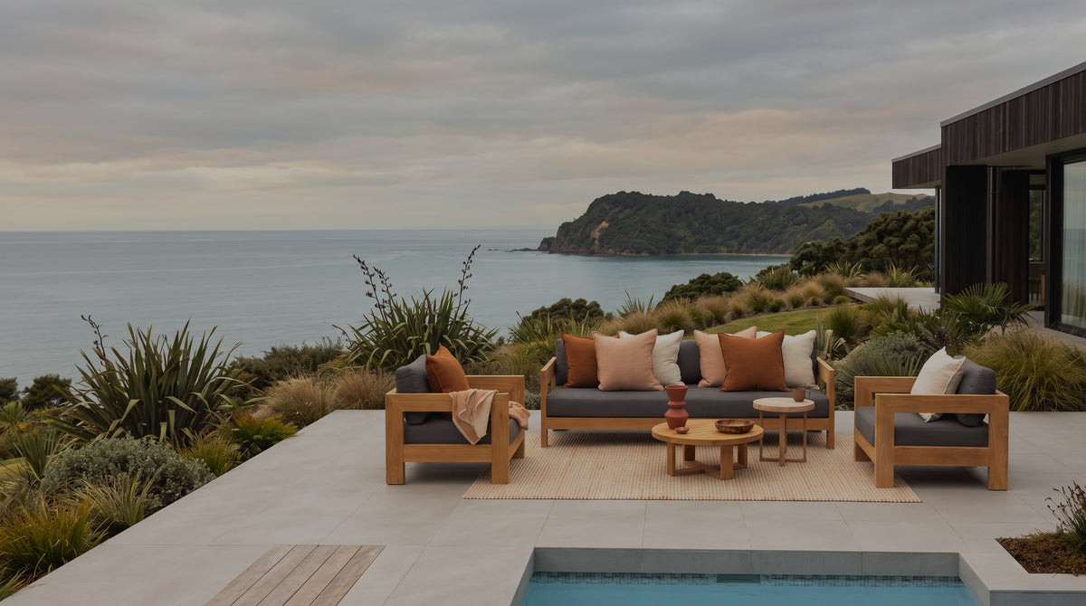 Pauanui Teak outdoor sofa on a coastal terrace above the sea