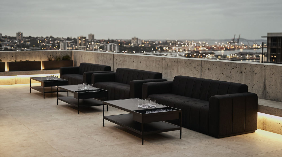 Matakana sofas repeated on a hotel rooftop terrace at dusk