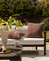 Dune Outdoor Throw Cushion in Claret – styled view