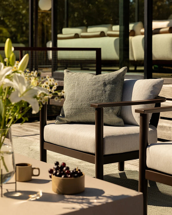 Dune Outdoor Throw Cushion in Eucalyptus – styled view