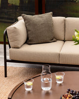 Dune Outdoor Throw Cushion in Mangrove – styled view