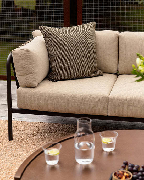 Dune Outdoor Throw Cushion in Mangrove – styled view