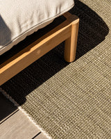 Lonsdale Outdoor Floor Rug in Olive styled beneath outdoor furniture