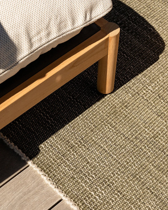 Lonsdale Outdoor Floor Rug in Olive styled beneath outdoor furniture
