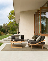 Lonsdale Outdoor Floor Rug in Olive styled in a covered outdoor dining space
