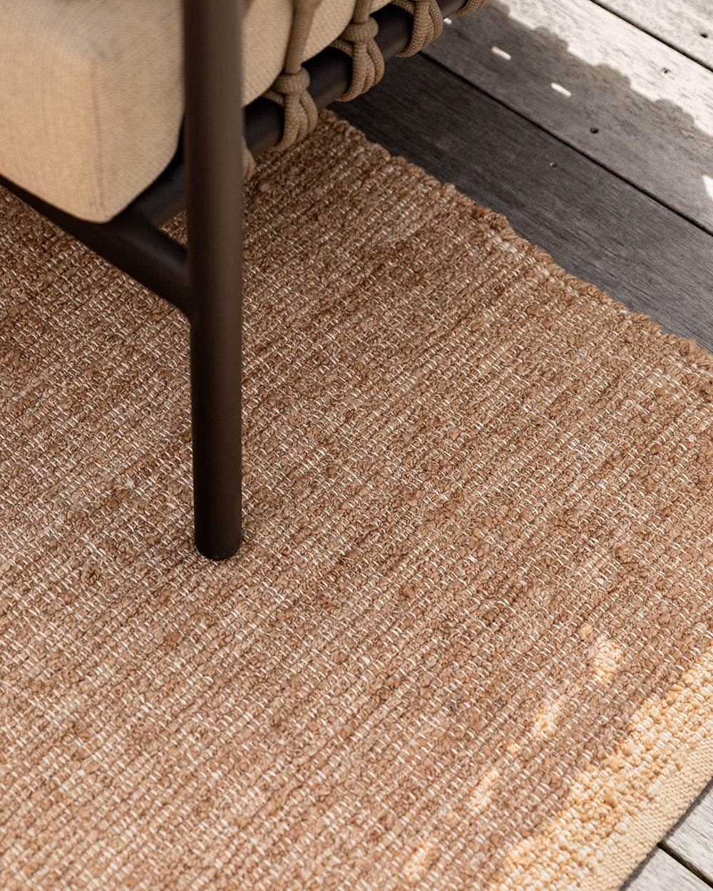 Ormond Outdoor Rug in Biscotti styled in an outdoor living space