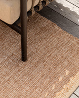 Ormond Outdoor Rug in Biscotti styled in an outdoor living space