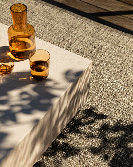 Ormond Outdoor Rug in Mineral styled in an outdoor living space